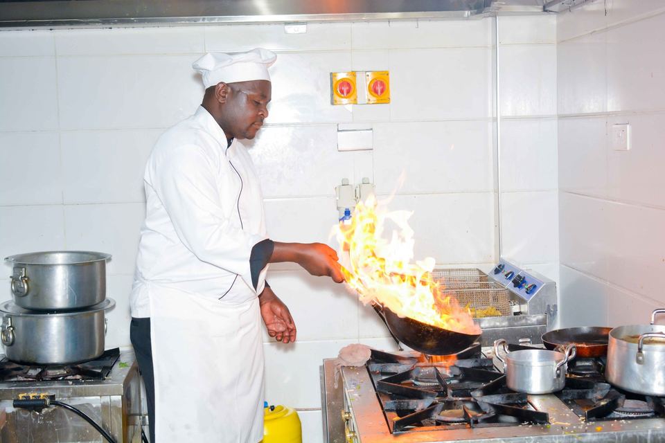 Our chef cooking over open flames